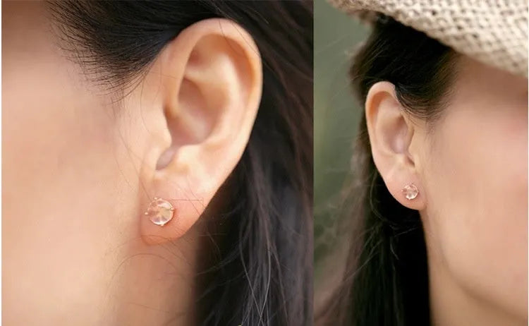 Rose gold drop-shaped stud earrings with synthetic ross quartz crystal inlay