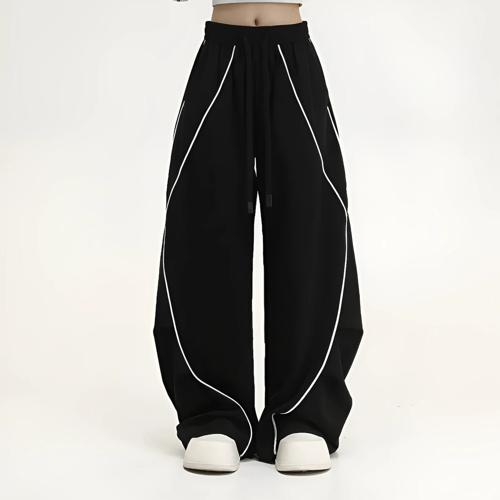 Black pleated wide-leg hip hop sports trousers with a stripe pattern on a mannequin