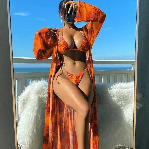 Floral pattern swimwear set with long sleeve blouse, banded bikini briefs, and matching outer robe in multiple colour options