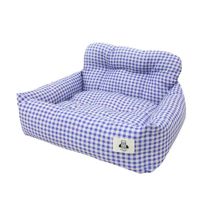 Grey and blue plaid car-mounted stain-resistant dog travel nest in two sizes.
