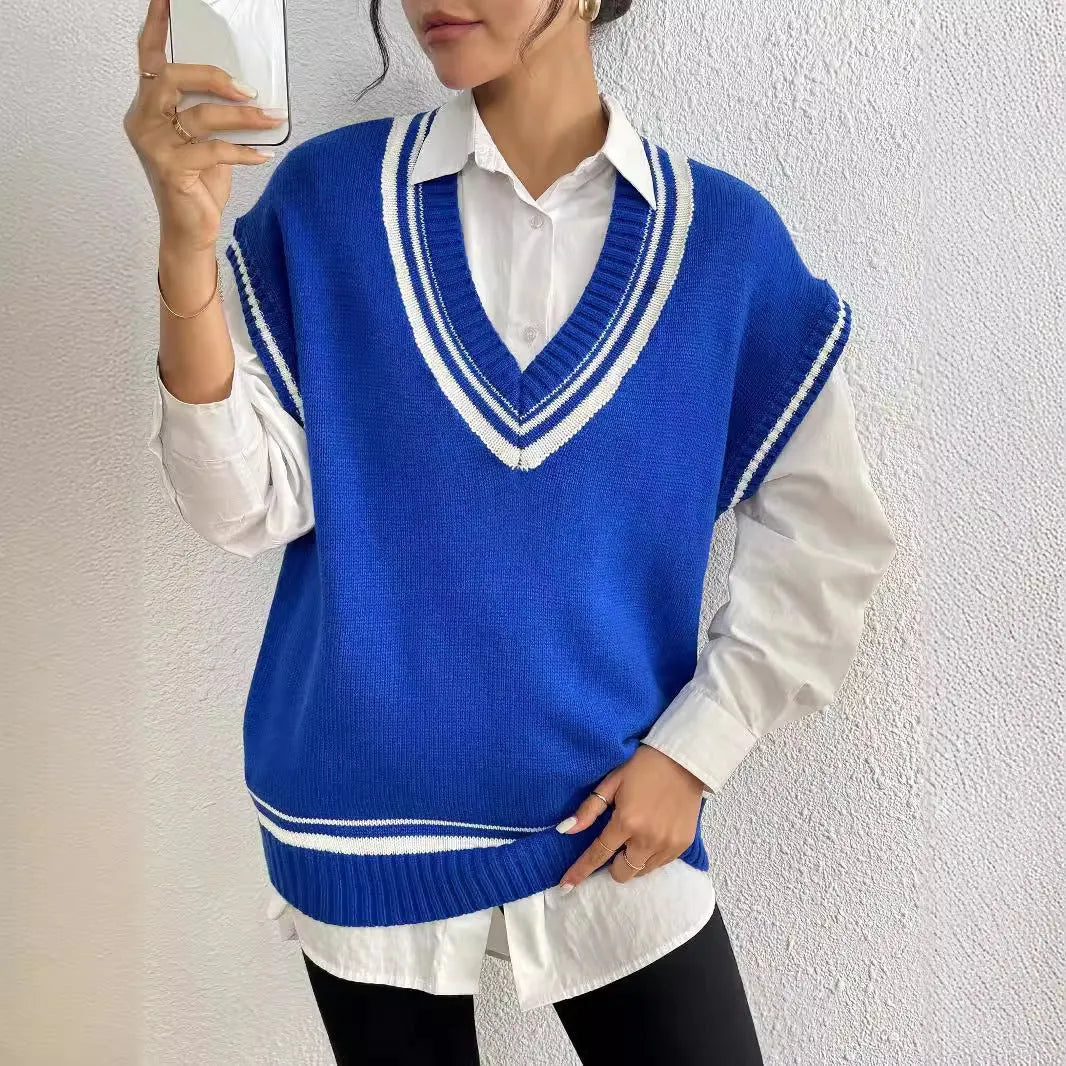 Loose fit blue women's vest sweater in college style, shown as a pullover on a hanger.