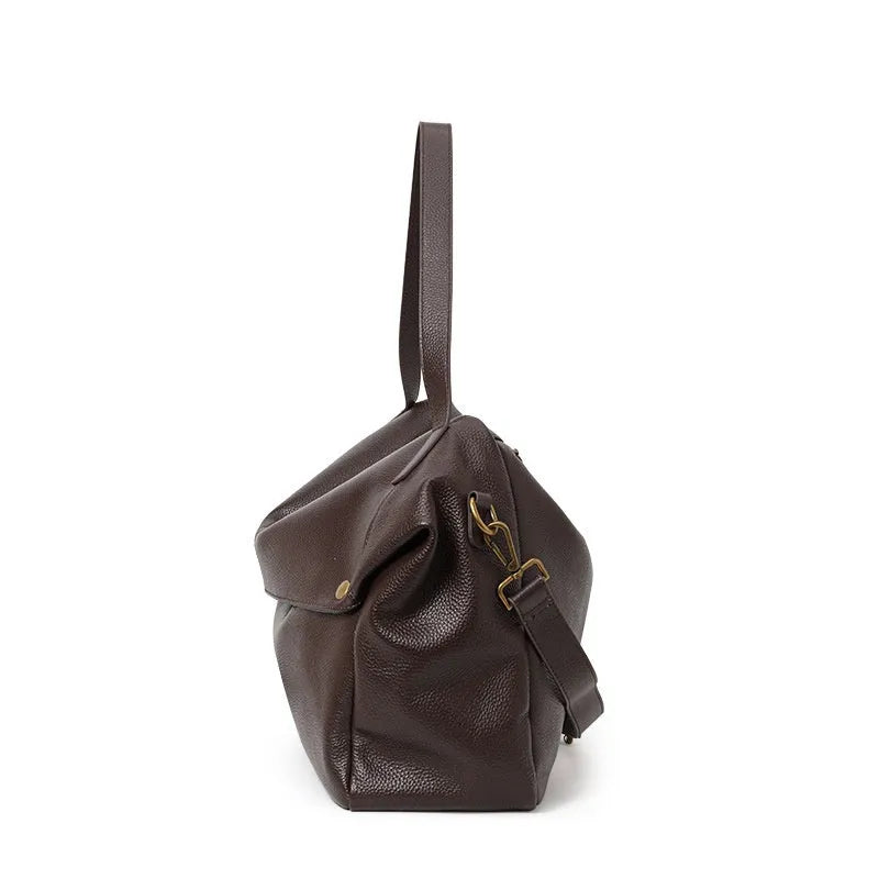 Brown genuine leather women's commuter shoulder bag with horizontal square shape showing zipper compartment