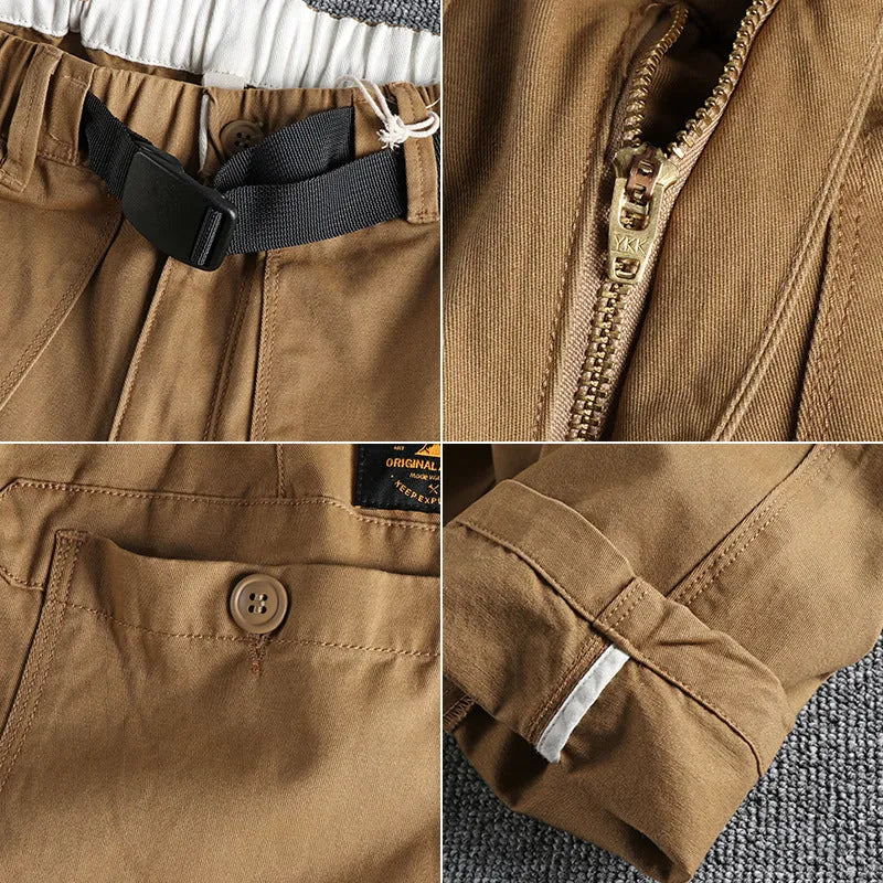 Men's khaki cotton work trousers with a flat buckle belt and zip fly, showcasing three-dimensional leg cutting.