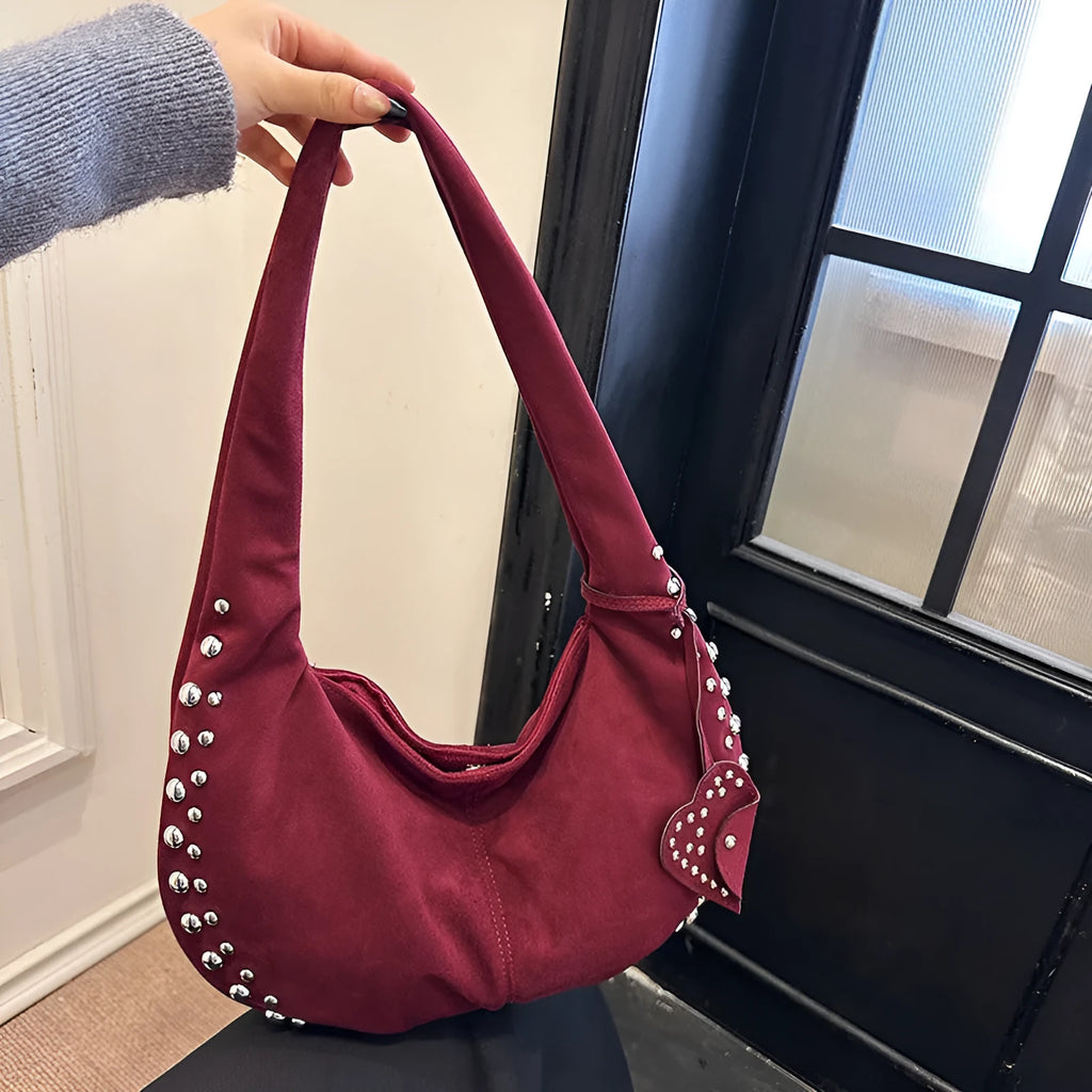 Soft plush casual tote handbag in a retro style, shown in a strapless underarm carry position.