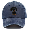Retro washed blue baseball cap with a detailed embroidered and printed dachshund design on the front.