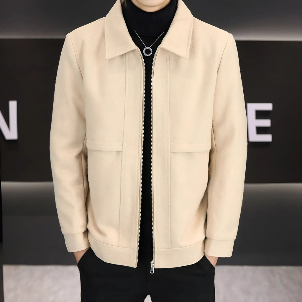 Man wearing a khaki polo collar casual jacket with side seam pockets.