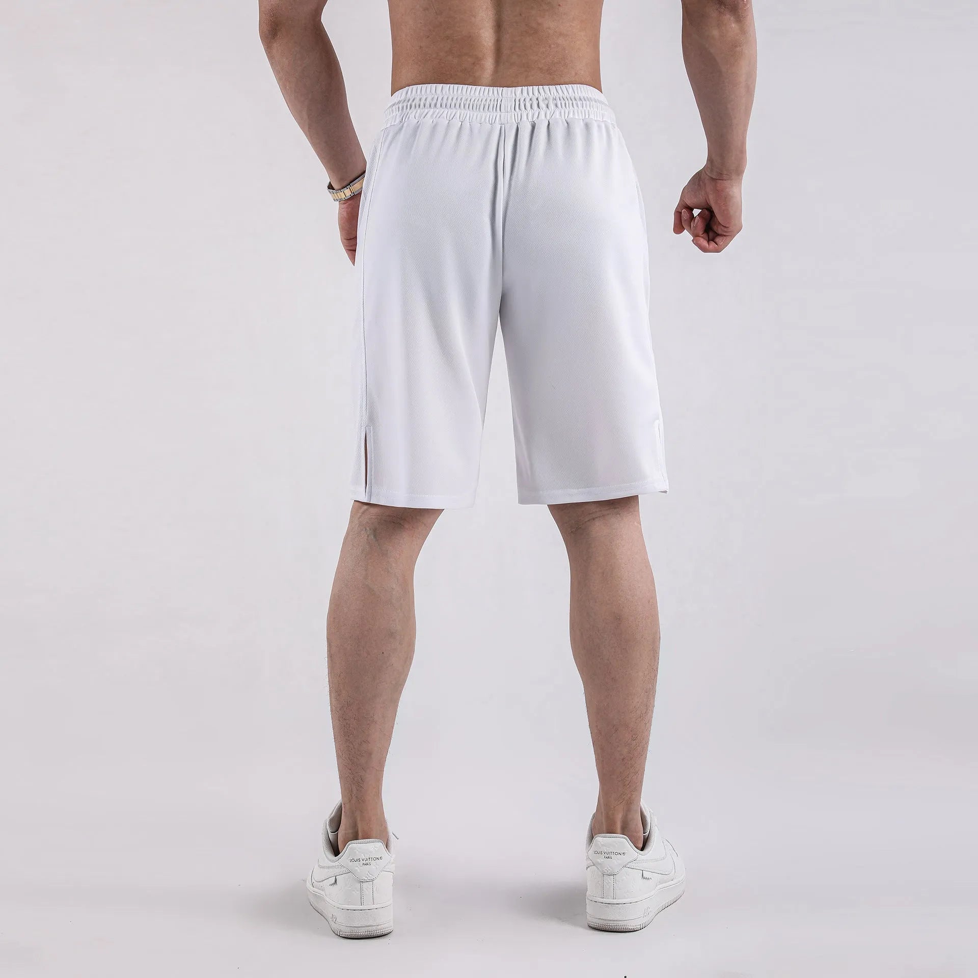 Men's black and white quick-drying loose-fit mesh shorts with elastic waistband.