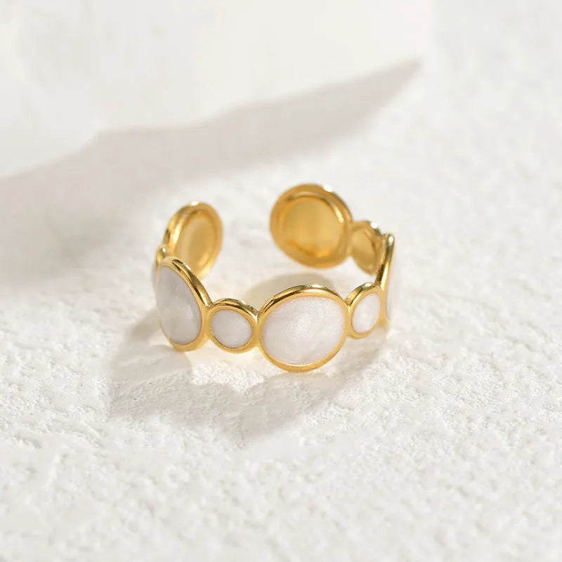 A geometric-shaped adjustable ring made from stainless steel with an electroplated metallic finish.