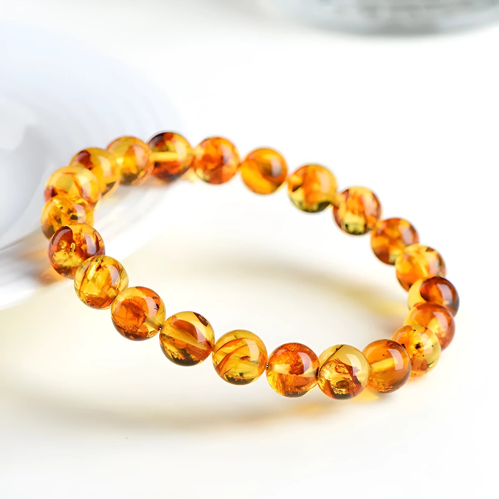 Natural yellow piebald amber water purification bracelet with geometric beads