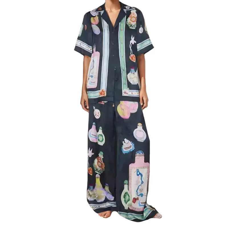 Black women's casual set with cartoon animation print showing cardigan top and matching trousers
