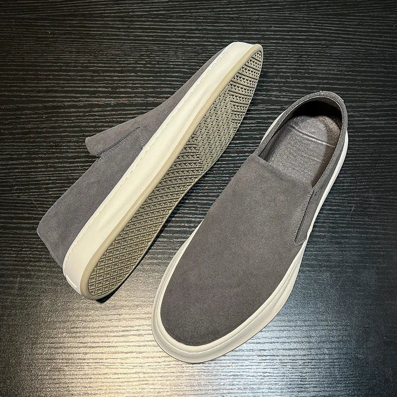 Men's grey casual lace-up shoes with round toe, stitching detail, and a rubber sole.