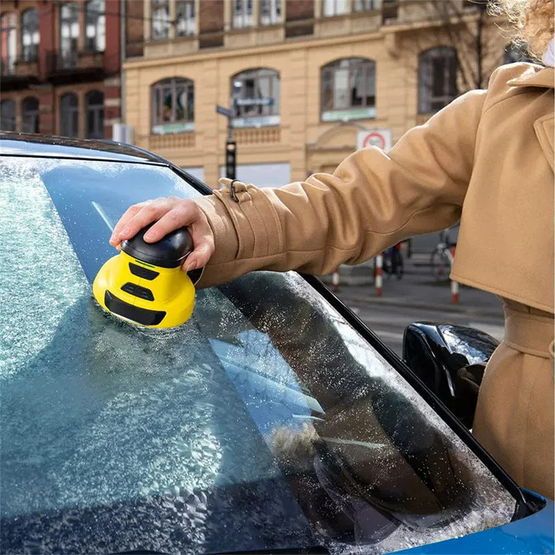Yellow cordless electric snow scraper with USB charging cable for car windshield ice removal