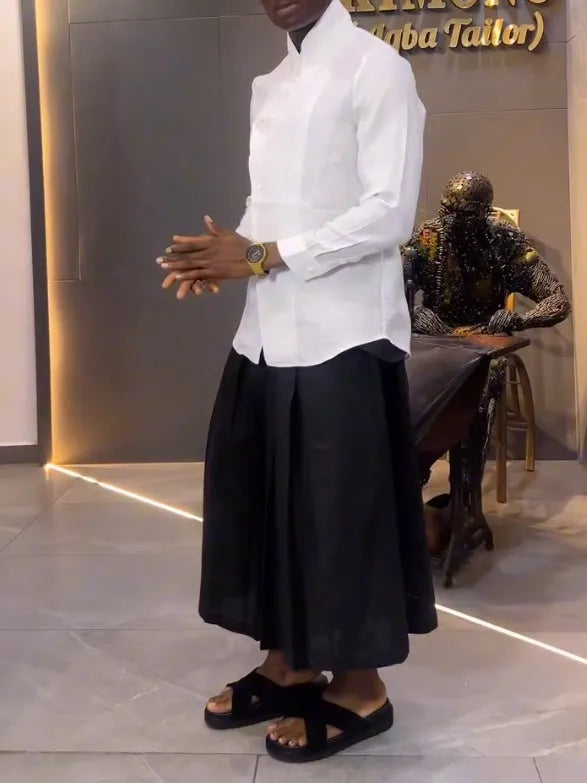 White asymmetric front women's shirt with black pleated trousers casual set