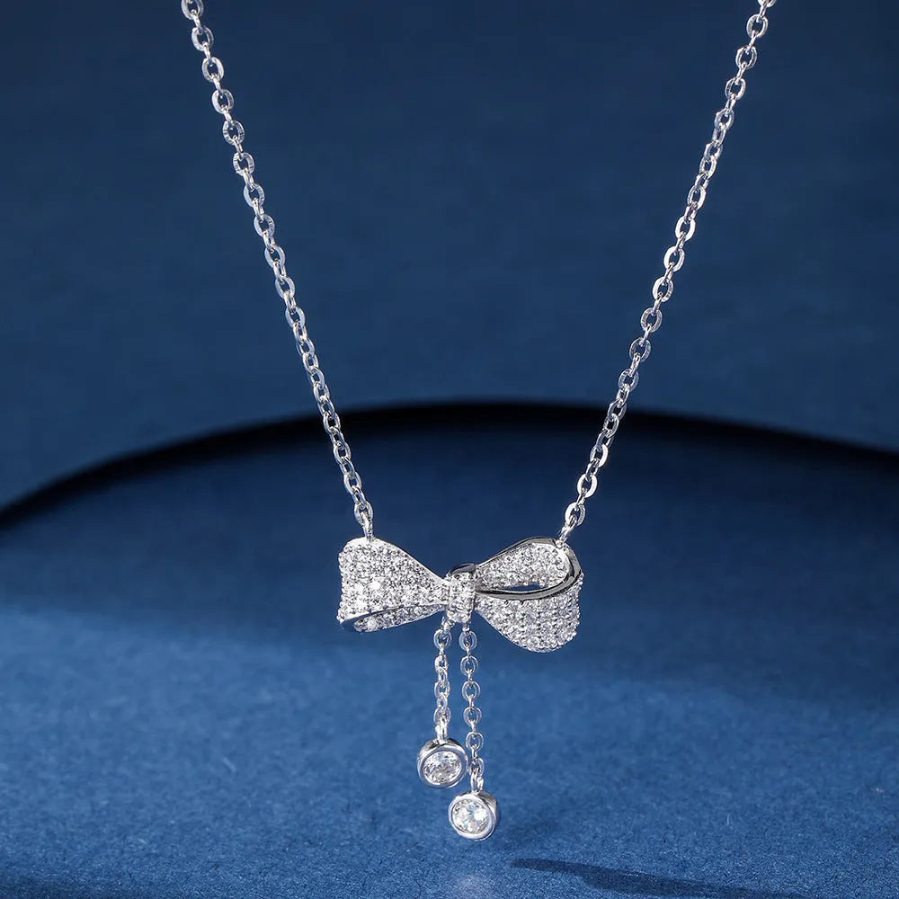 S925 sterling silver bow pendant necklace on adjustable O-ring chain, clavicle length