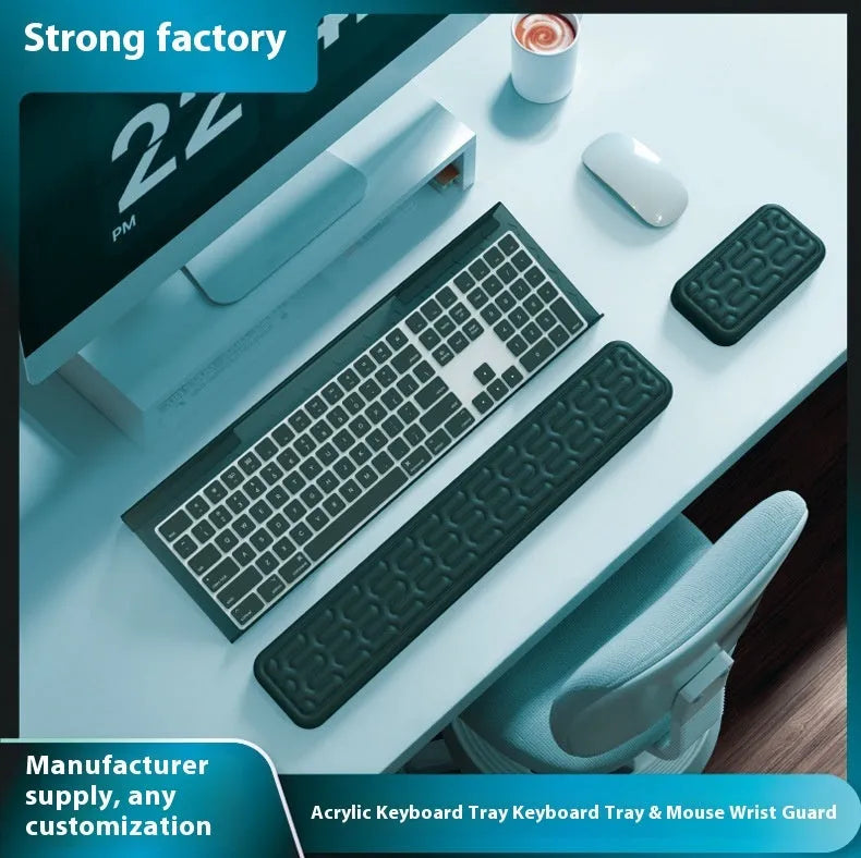 Double-sided black resin keyboard and mouse desk pad with integrated memory foam wrist rest.