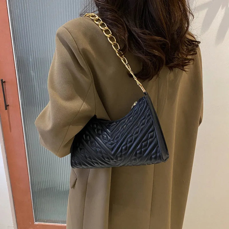 Brown PU pleated chain baguette shoulder bag showing vertical square shape with sewing line detailing