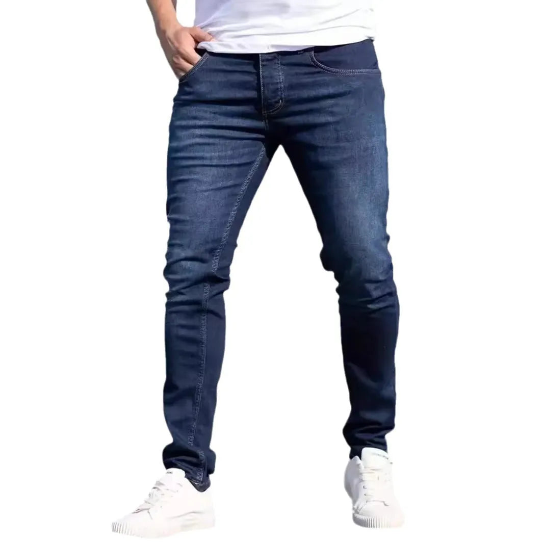 Men's dark blue slim fit casual jeans with skinny leg street fashion styling