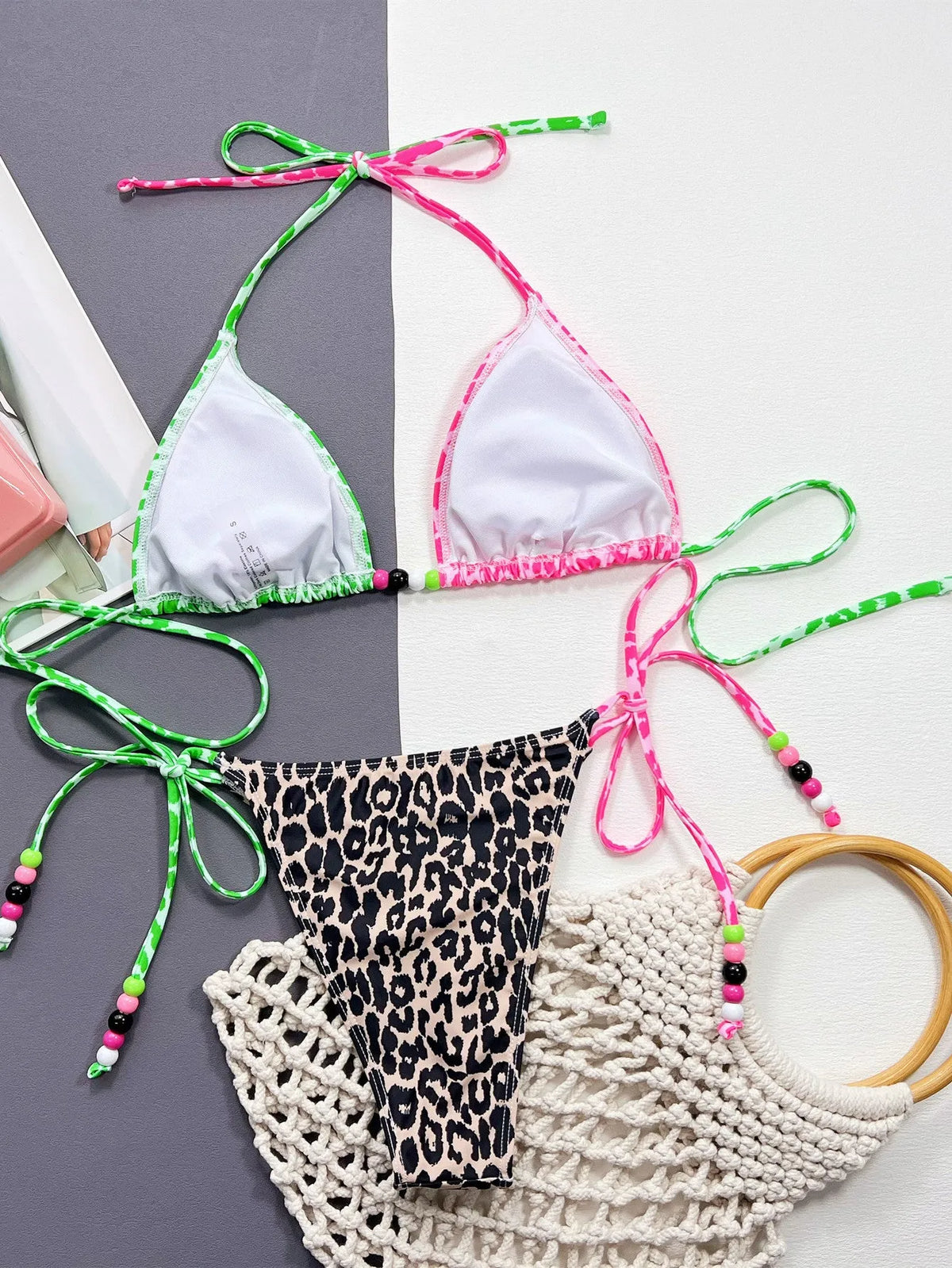 Women's leopard print bikini swimsuit with split cup design and matching briefs