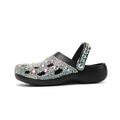 Black platform sandals for women with rhinestone detail on an EVA upper and sole.