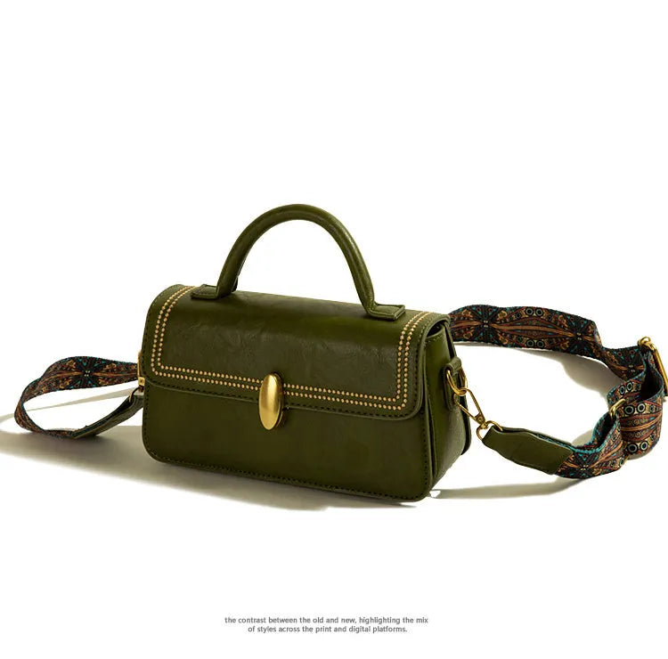 Brown retro messenger bag showing square vertical shape and internal organisation compartments