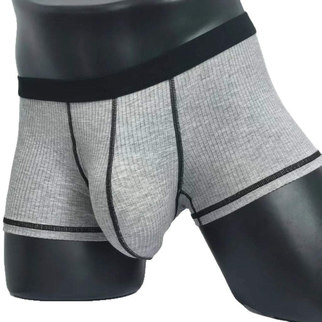 Men's solid colour boxer shorts in breathable fabric on a size chart showing L, XL, 2XL, and 3XL.