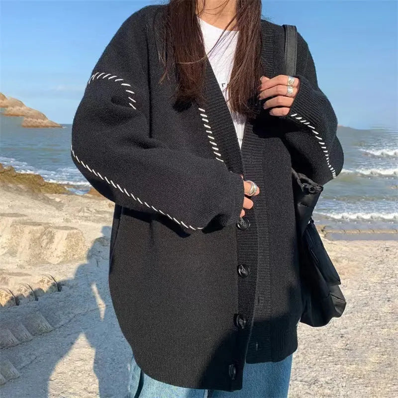 Women's loose fit knitted cardigan top coat in black or white with long sleeves
