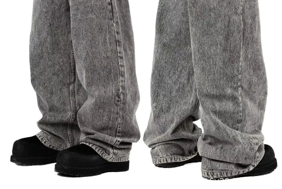 Grey loose-fit straight-leg cotton denim trousers on a mid-waist mannequin