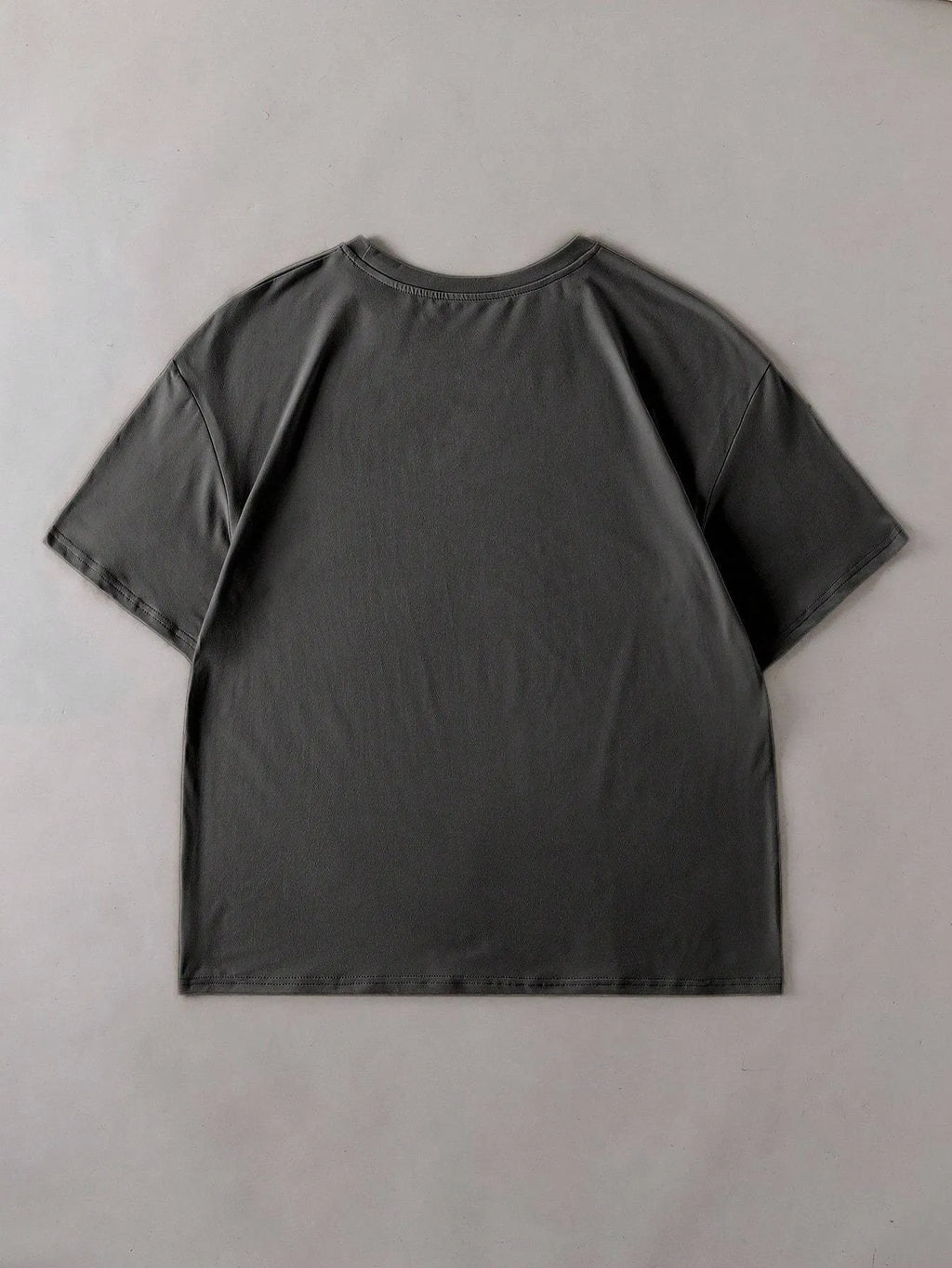 A loose-fit cotton T-shirt in a straight cut style with short sleeves and a round neck.