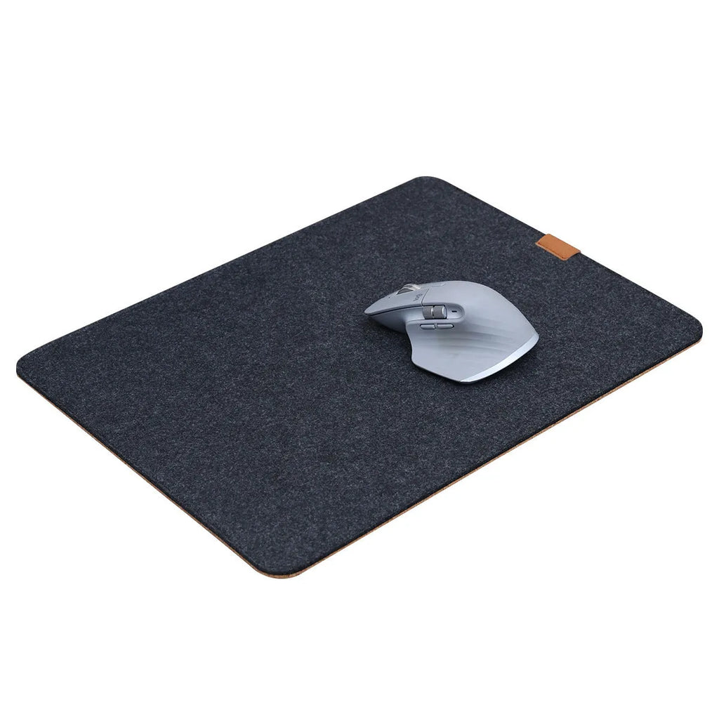 Medium grey felt cork oversized desk mat with Japanese style simple design on a wooden desk.