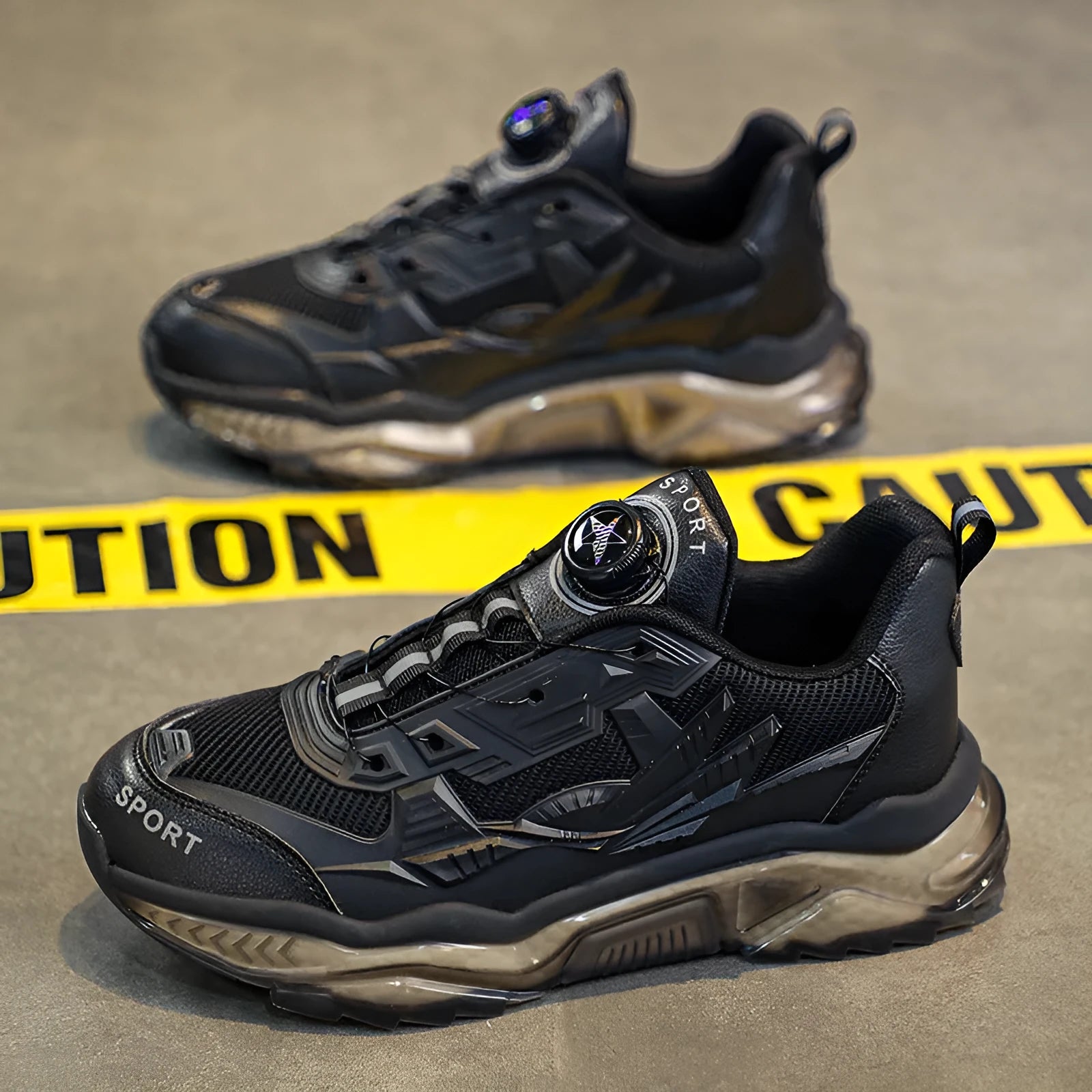 Men's black casual sneakers with rotating button closure and mesh upper on platform sole