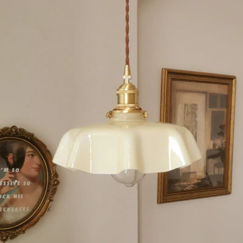 Medieval French style brass and glass flower bud chandelier light fitting with adjustable cord.