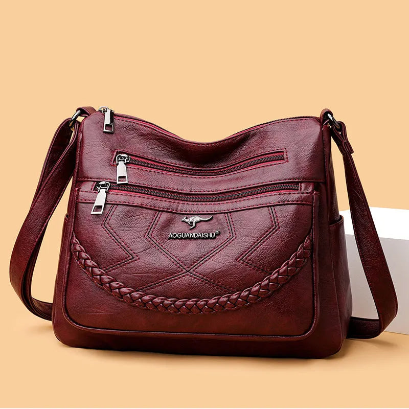 Soft black PU leather women's crossbody bag showing square shape and outer pocket