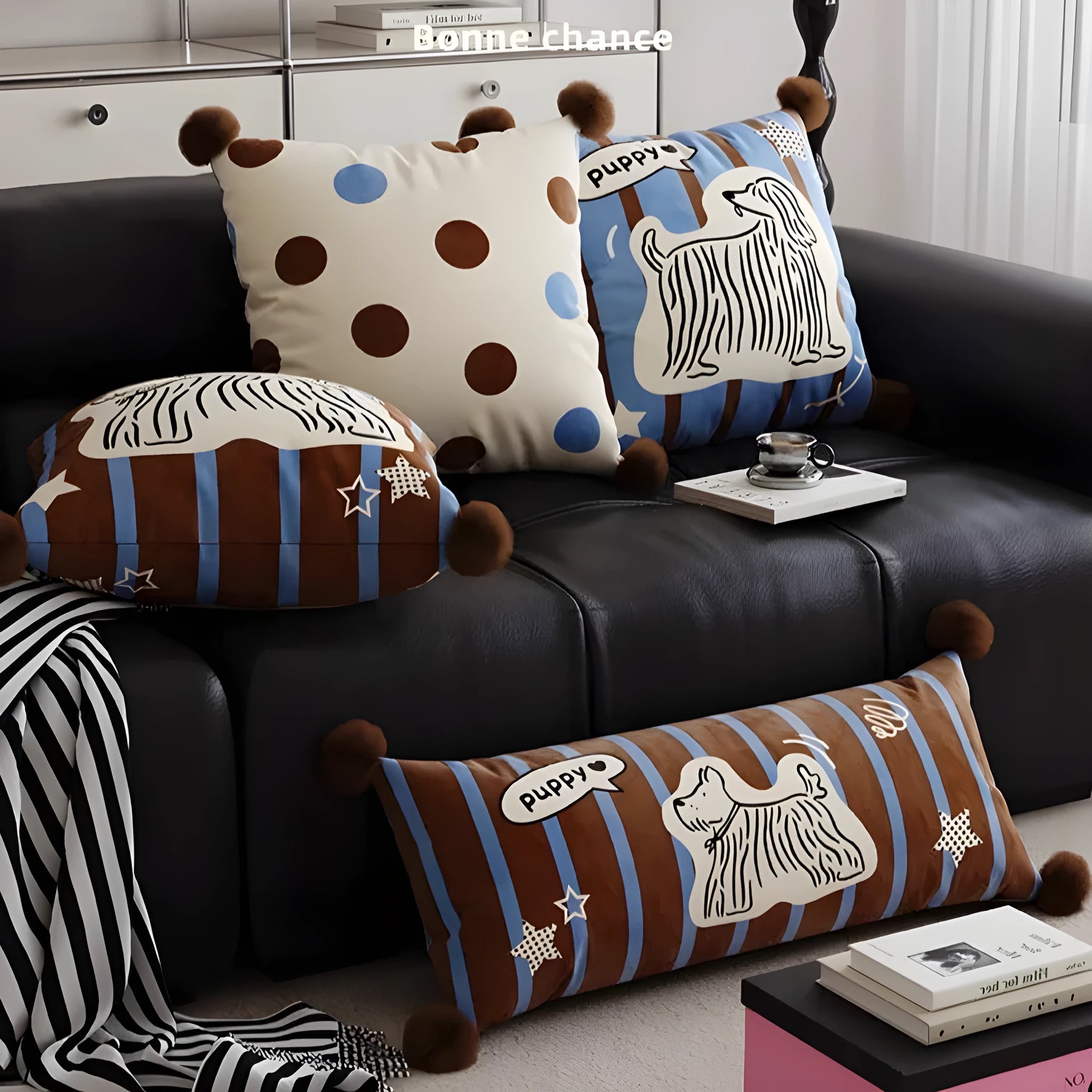 Blue cartoon animal print sofa cushion pillow with matching pillowcase on a grey sofa.