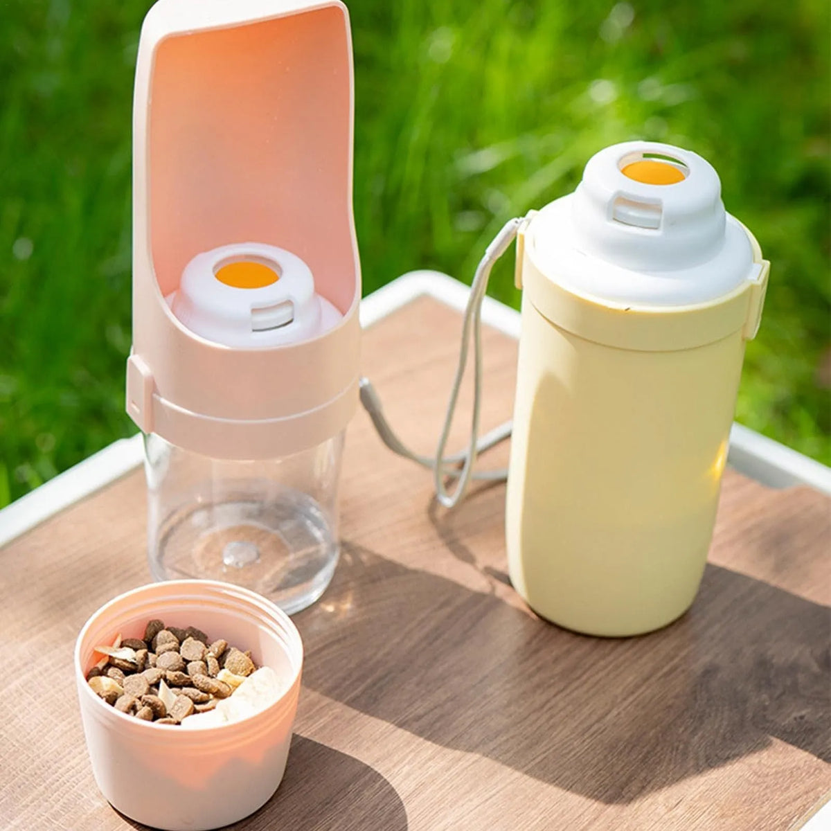 Green portable dog water bottle and feeder with lanyard attached
