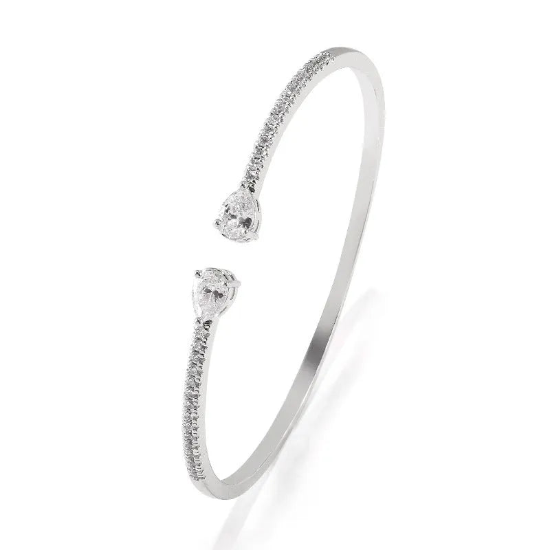Copper bracelet with multi-zircon decorative inlay in simple style, shown in blue and white colour options