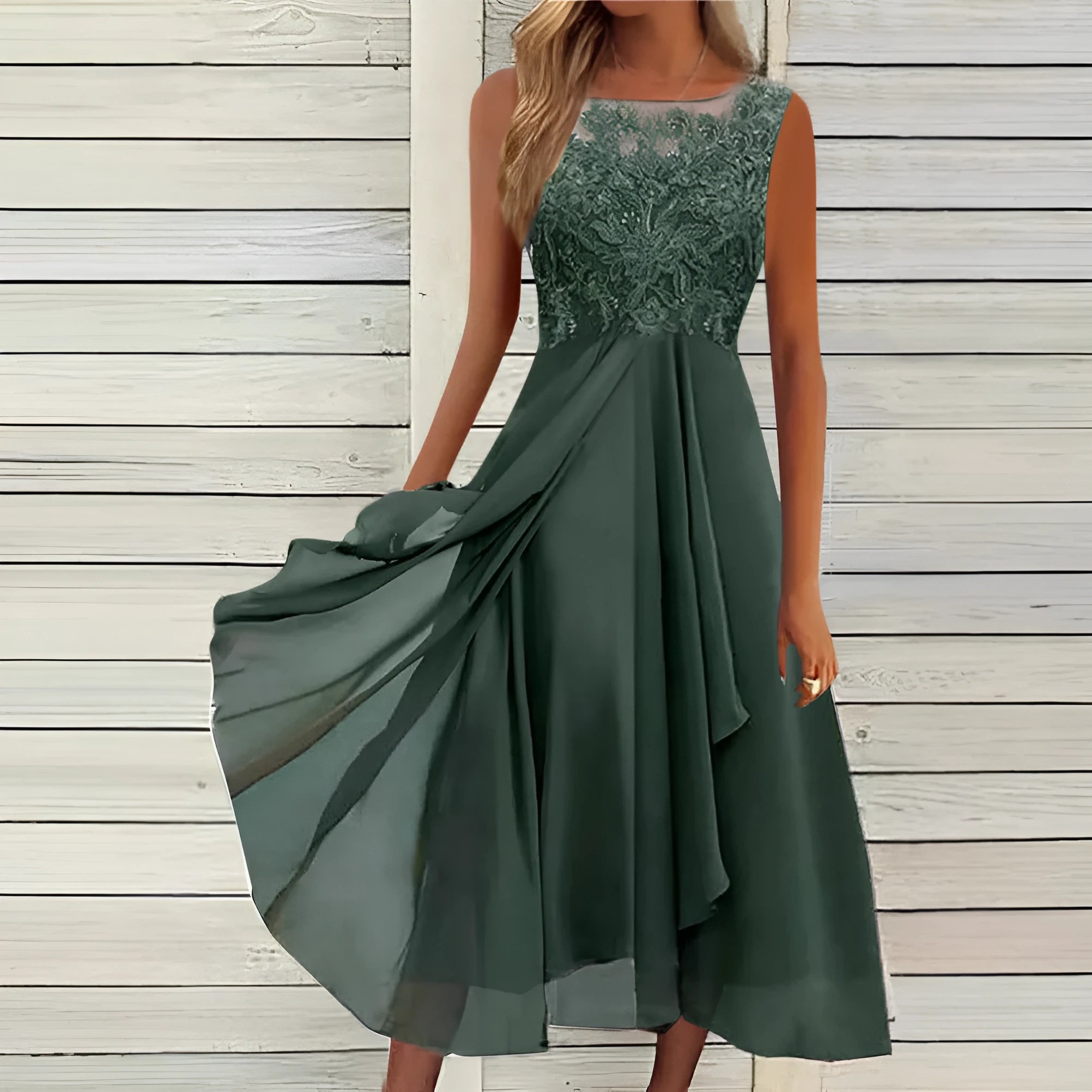 Women's sleeveless chiffon dress with hollow-out lace detail in green, shown on a hanger.