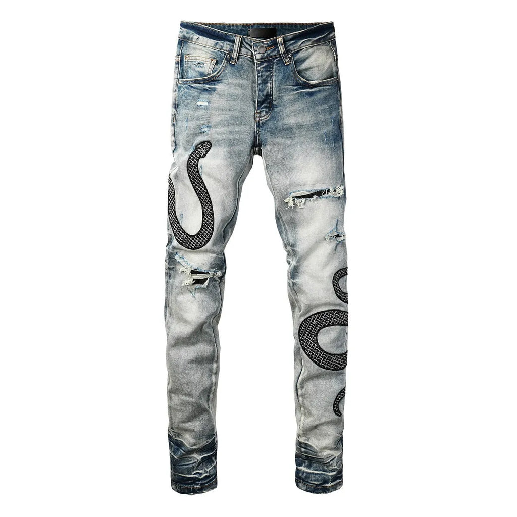 Man's blue distressed skinny jeans with a street fashion wash and button fly.