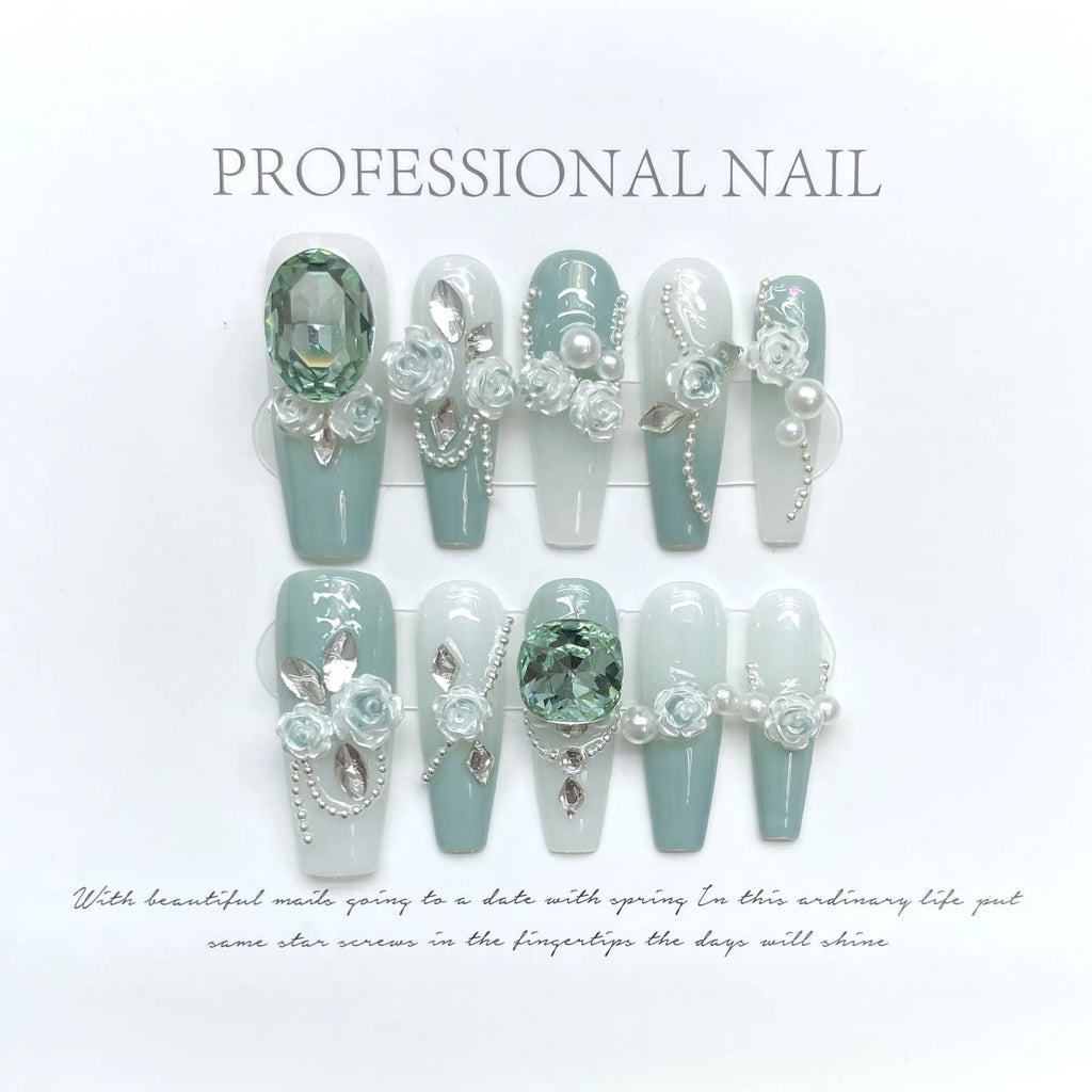 Camellia gradient chain nail art set with diamond, bow and butterfly designs on plastic armour suit