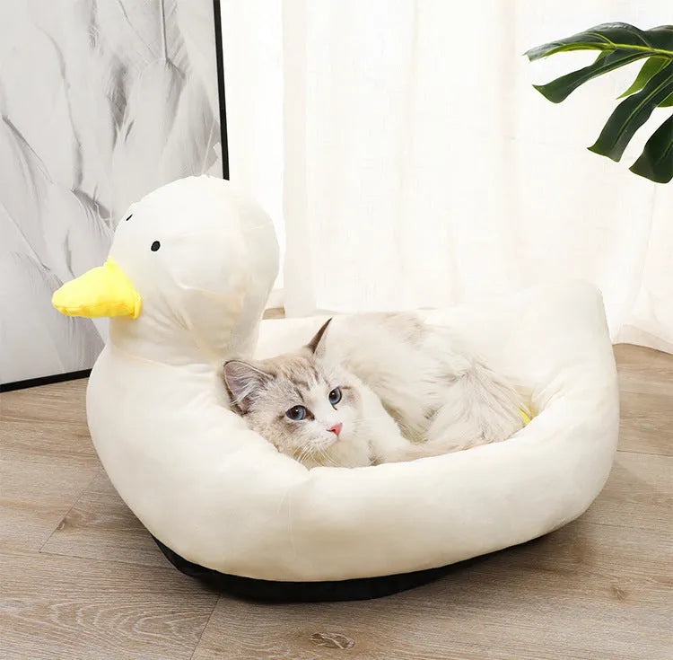 Blue duck-shaped fluffy pet bed sofa for small dogs and cats on floor
