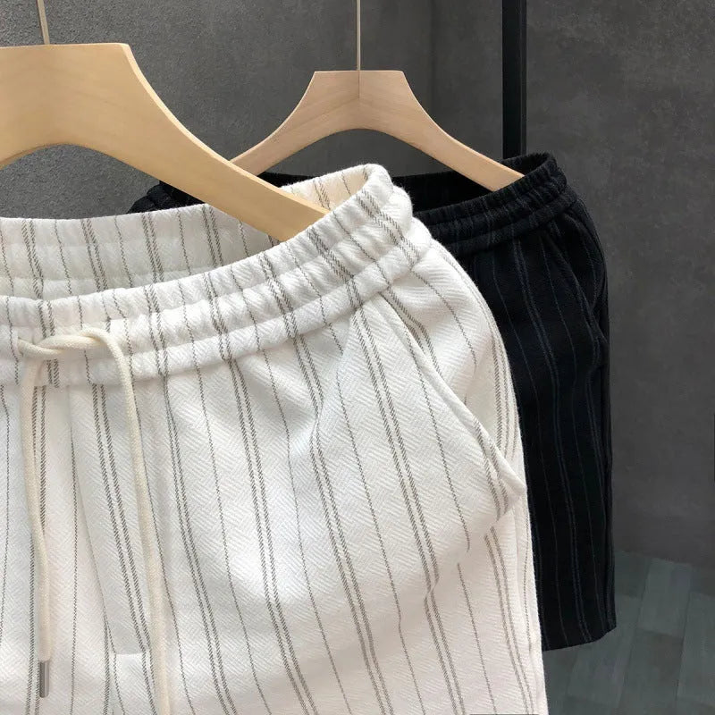 Men's black and white striped casual shorts with double-layer waistband and ankle banded styling