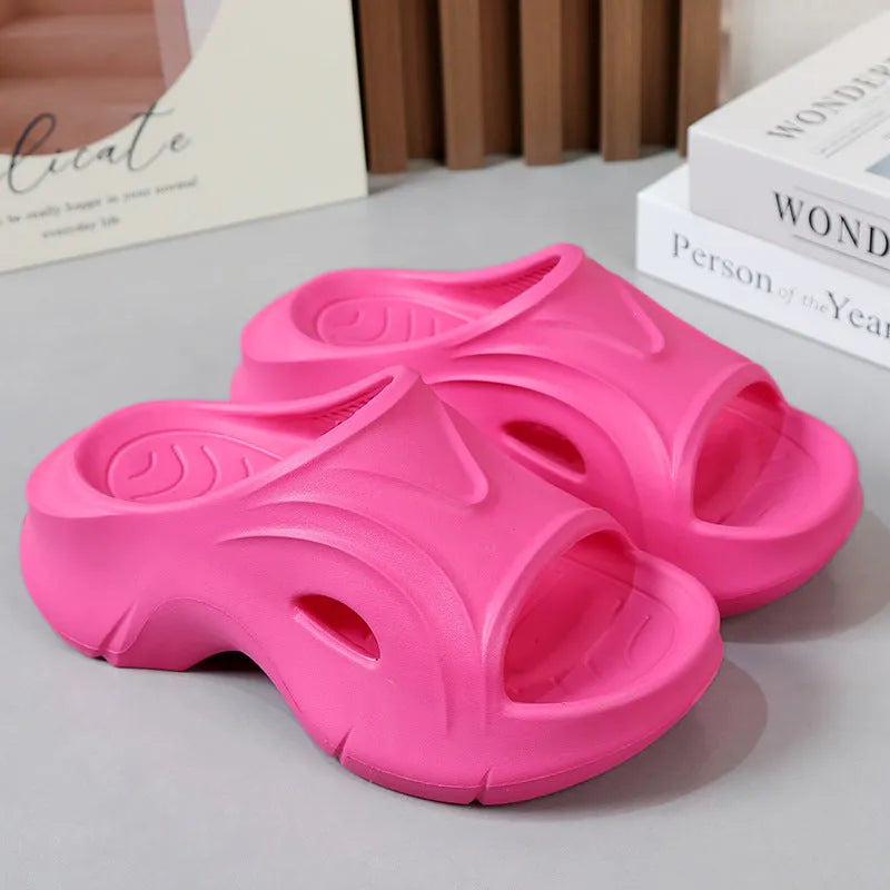 Women's white EVA slippers with thick sole and round toe on sandy beach
