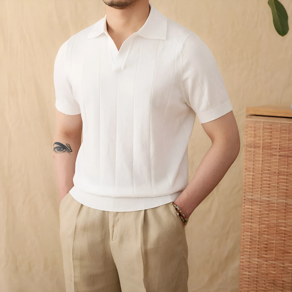 Man wearing a purple short sleeve polo shirt with a seagull collar, made from a knitted cotton and linen blend fabric.