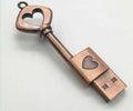 Heart shaped bronze metal USB flash drive pendant with USB 2.0 interface and write protection switch.