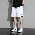 Cotton shorts for boys in black, khaki, or white, showing mid-waist and shorts-length design.