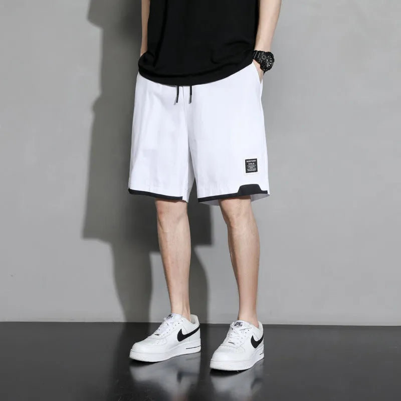 Cotton shorts for boys in black, khaki, or white, showing mid-waist and shorts-length design.