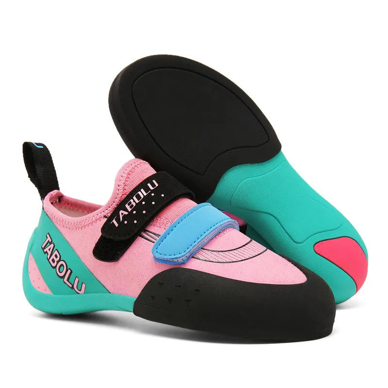 Beginner unisex rock climbing shoes with black and red colourway, showing Velcro strap and rubber sole.