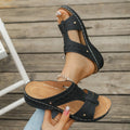 Roman style slope heel slippers with fish mouth toe in multiple colours on a rubber sole.