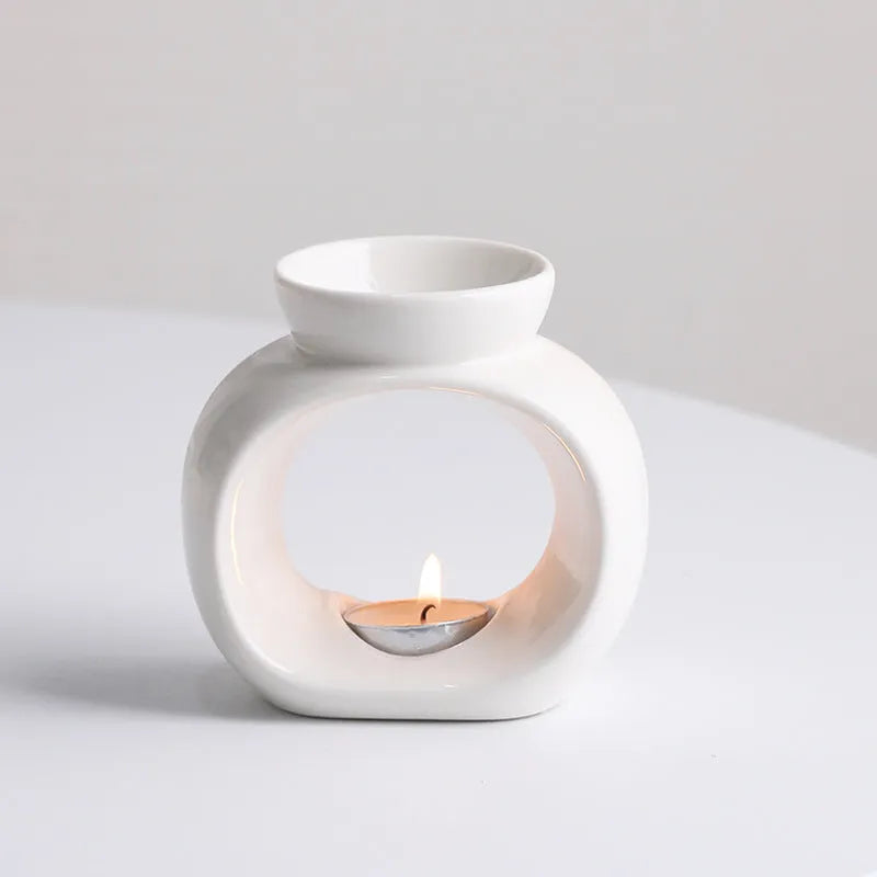 White Nordic style ceramic aromatherapy stove ornament on a tabletop