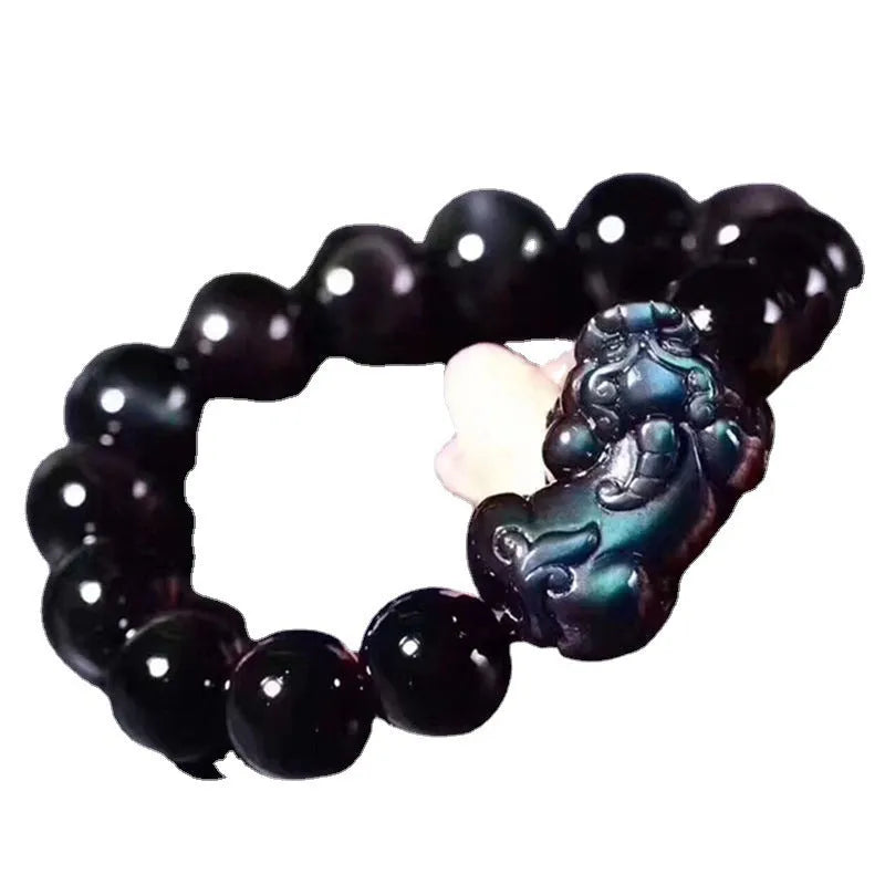 Natural ice colour obsidian crystal bead bracelet showing different bead size options on a wrist.