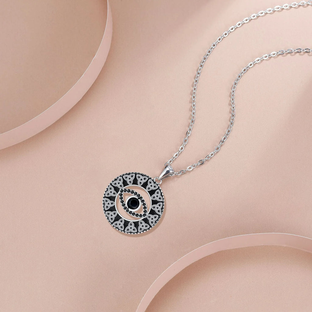 Copper necklace with a Devil's Eye pendant on a cross chain for women.